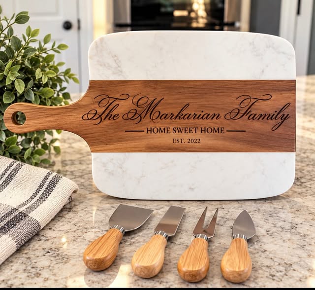 Marble and acacia charcuterie board engraved 'The Markarian Family, Home Sweet Home, Est. 2022' with a set of cheese knives